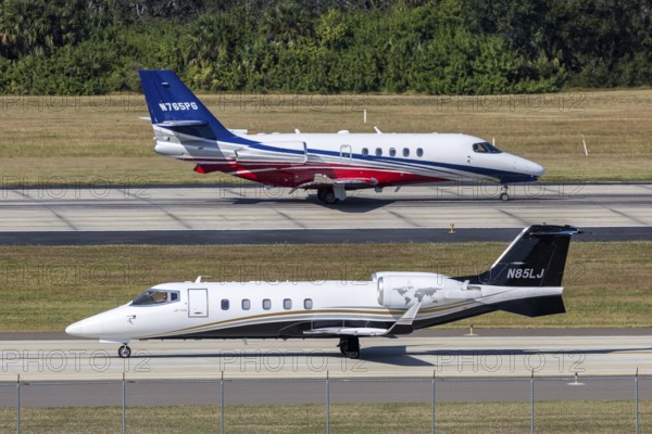 Bombardier Learjet and Cessna Citation Latitude private jet aircraft with license plate N85LJ at Tampa airport, USA