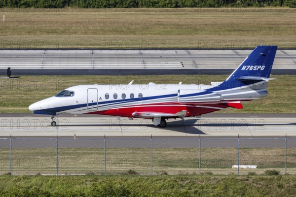 A Nicholas Air Cessna 680A Citation Latitude private jet aircraft with license plate N765PG at Tampa airport, USA