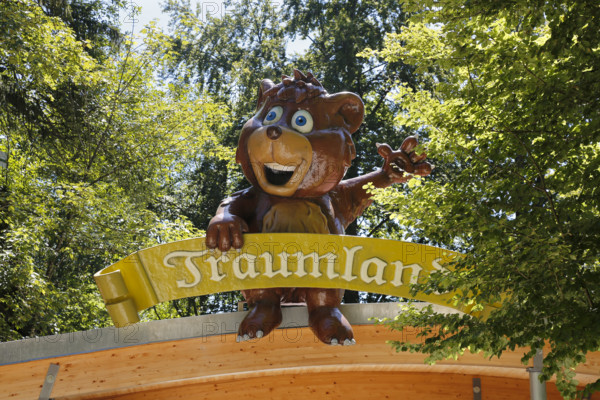 Amusement park Traumland auf der Bärenhöhle, amusement park in Sonnenbühl, entrance, sign, figure, replica bear, leaves, Sonnenbühl, Swabian Jura, Baden-Württemberg, Germany