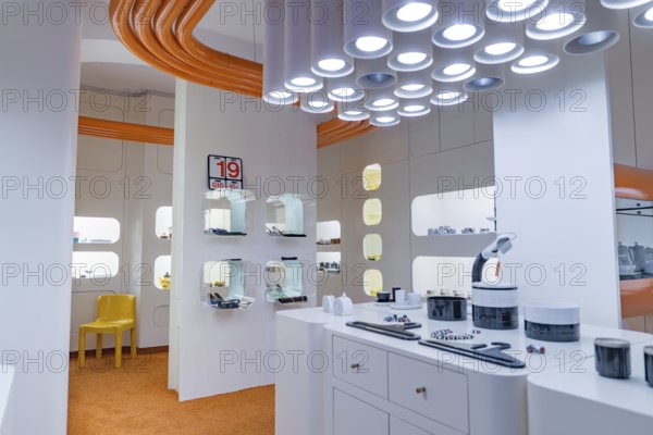 Futuristic interior with white design and eye-catching orange and white lighting