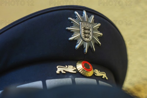 Close-up of a police cap with crest and blue fabric