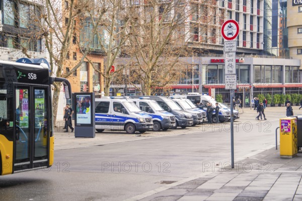 Urban scene with police car, bus and road signs on a cold day
