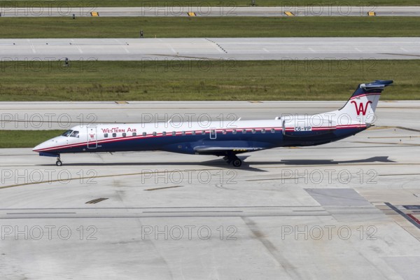 A Western Air Embraer 145 aircraft with the license plate C6-VIP at Fort Lauderdale airport, USA