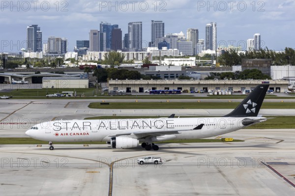 An Air Canada Airbus A330-300 aircraft with the license plate C-GHLM and Star Alliance special livery at Fort Lauderdale airport, USA
