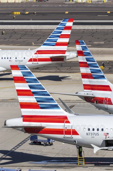 Boeing and Airbus aircraft tail units of American Airlines with the license plate N737US at Phoenix airport, USA