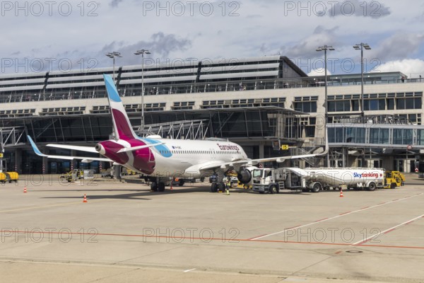 A Eurowings Europe Airbus A320 aircraft with the license plate 9H-EWC at the airport in Stuttgart, Germany