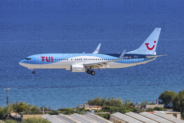 A TUI Boeing 737-800 aircraft with license plate D-ABMQ at Rhodes airport, Greece