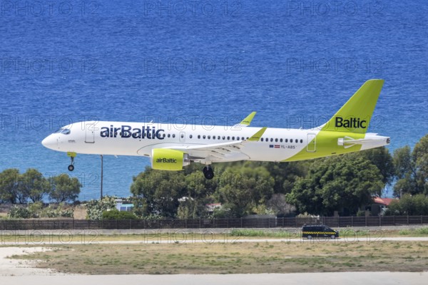An Airbus A220-300 Air Baltic aircraft with the license plate YL-ABS at Rhodes airport, Greece