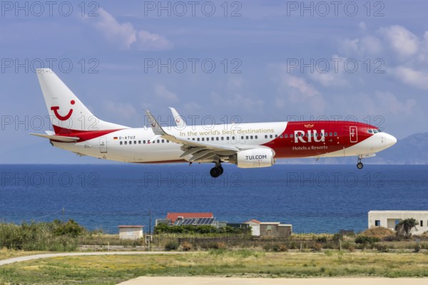 A TUI Boeing 737-800 aircraft with the D-ATUZ license plate and RIU Hotels & Resorts special livery at Rhodes Airport, Greece
