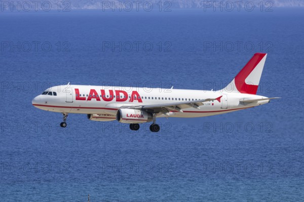 A Lauda Europe Airbus A320 aircraft with the license plate 9H-LOM at Rhodes airport, Greece