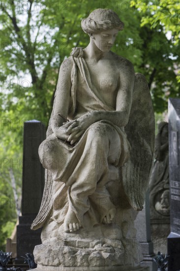 Female sculpture, hands folded, Lützenhofer cemetery Lychakivsky cemetery, Lviv, Galicia, Ukraine