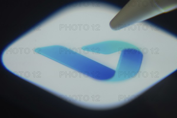 Dhaka, Bangladesh- 06 Dec 2025: Close-up of the Microsoft Bing app on a screen with a stylus pointing at it