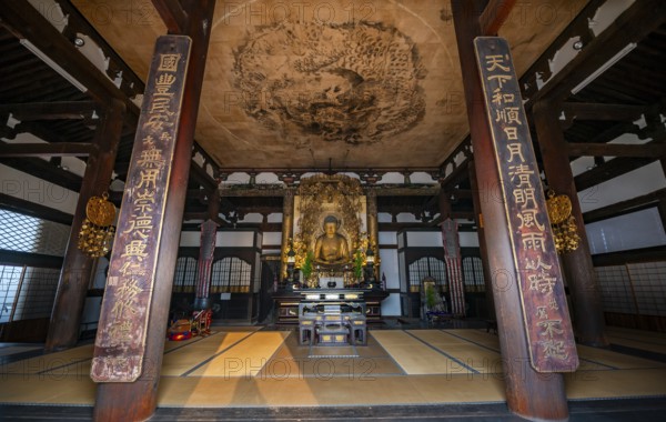 Interior view, golden Buddha figure and ceiling painting with dragon figure, Amidado, Buddhist temple, Konkai-Komyoji temple, Kyoto, Japan