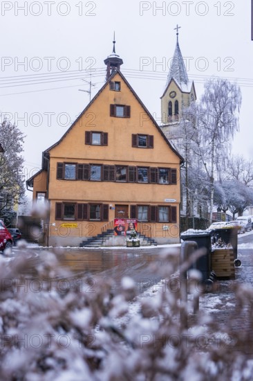 Historic building. Old town hall and church in the snow, typical traditional village architecture, Gechingen, Calw district, Germany
