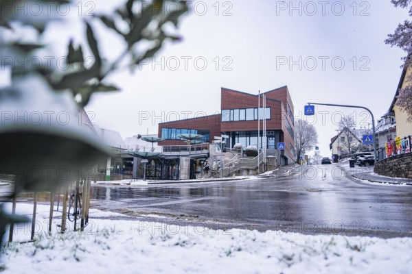 Modern architecture town hall, in a snowy town, quiet atmosphere with snowy street, Gechingen, Calw district, Germany