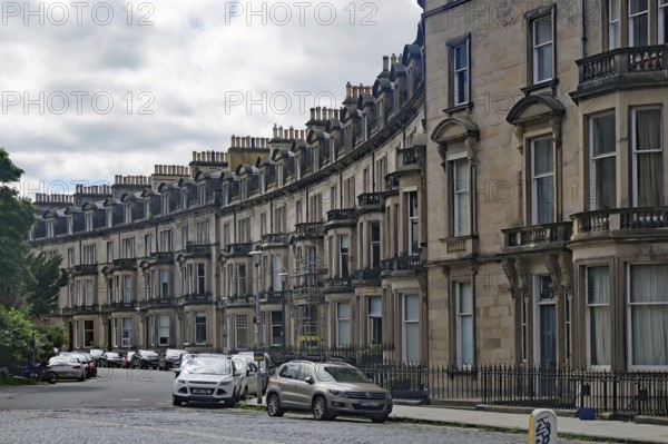 A curve with elegant townhouses and parked cars in a residential area, Newtown, Edinburgh, Scotland, United Kingdom