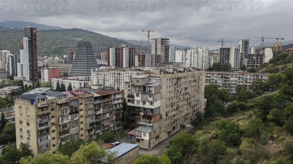 Panoramic view of a residential area with construction cranes and high-rise buildings, Tbilisi, Georgia