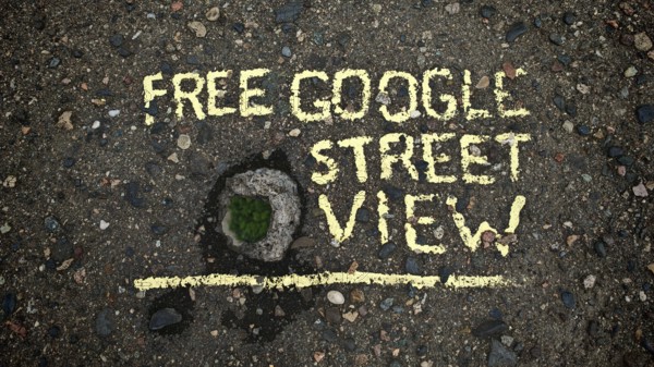 Concrete bridge with hole in asphalt with yellow text 'Free Google Street View, 'funny, Tbilisi, Georgia