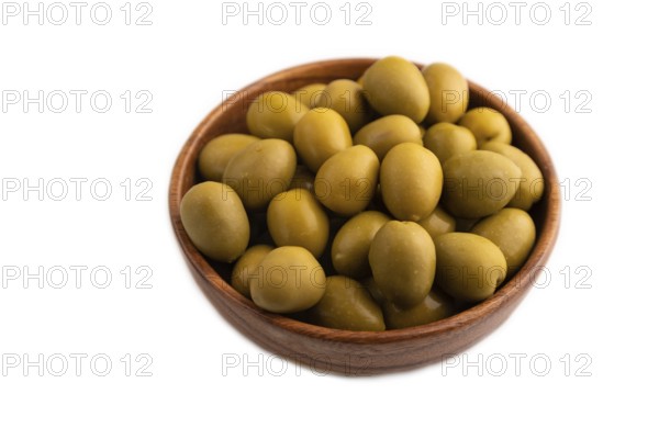 Fresh green olives in wooden bowl isolated on white background. side view, close up