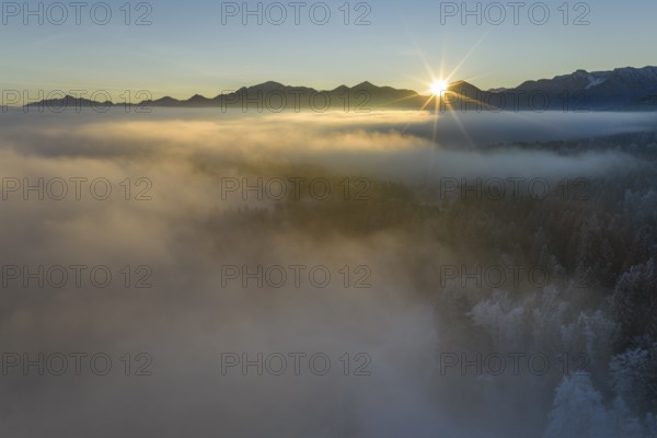 Sunrise, fog, high fog, mountain landscape, back light, hoarfrost, cold, winter, sunny, aerial view, view of Benediktenwand, Estergebirge, foothills of the Alps, Bavaria, Germany
