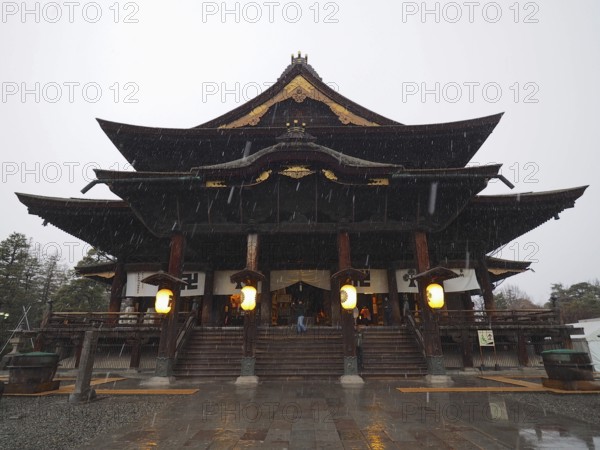 Japanese temple in rain giving off a calm atmosphere, Zenko-ji Temple, Nagano, Japan