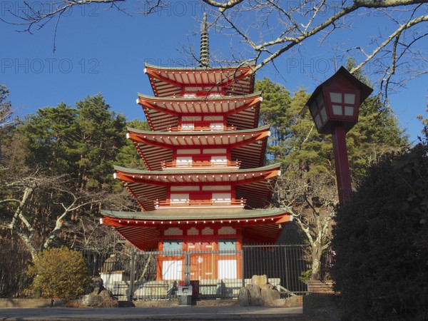 Five-story pagoda in traditional Japanese style surrounded by trees, Chureito Pagoda, Kawaguchiko, Japan