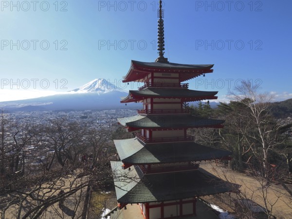 Panoramic view of Chureito Pagoda and snow-capped Mount Fuji in the distance, Kawaguchiko, Japan