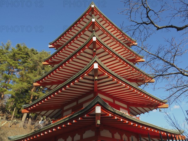 Close-up view of a multi-storey pagoda with blue sky in the background, Chureito Pagoda, Kawaguchiko, Japan