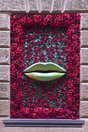 Window with rose petals and gold-colored mouth, Casanova restaurant, Lviv, Ukraine