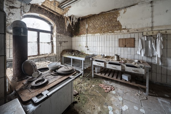 Dilapidated kitchen full of rubble in an abandoned country inn, Lost Place, Saxony-Anhalt, Germany