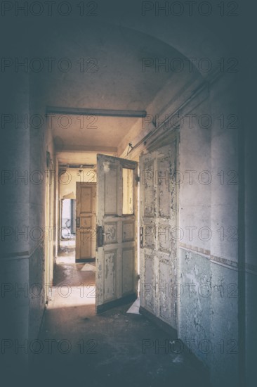 Corridor of an abandoned administration building in the light of the evening sun, Lost Place, Saxony-Anhalt, Germany
