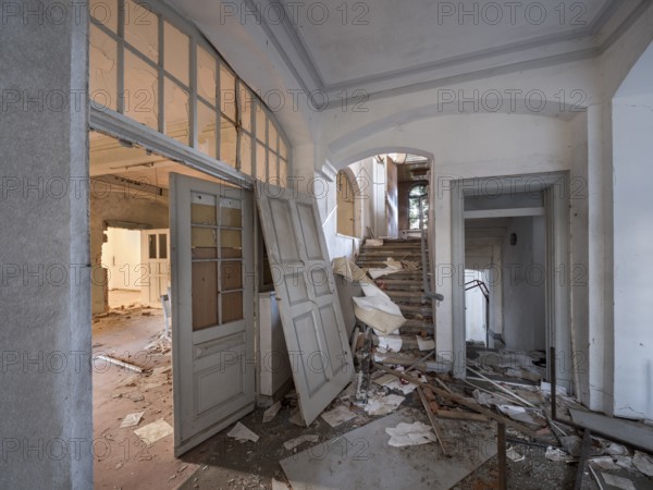 Staircase of an abandoned administration building full of rubble and trash, Lost Place, Saxony-Anhalt, Germany