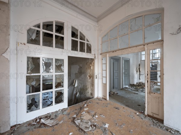 Staircase of an abandoned administration building full of rubble and shards, Lost Place, Saxony-Anhalt, Germany