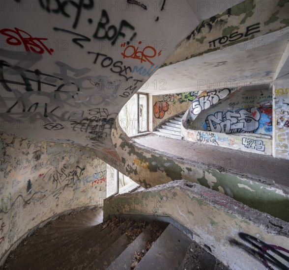 Dilapidated stairwell full of graffiti in a former FDGB holiday home, Lost Place, Saxony-Anhalt, Germany