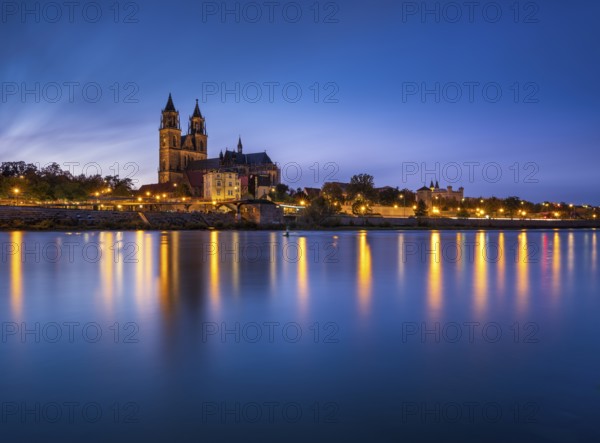 City view with Magdeburg Cathedral on the river Elbe at dusk, Magdeburg, Saxony-Anhalt, Germany