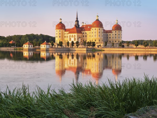 Moritzburg Castle, Augusts the Strong hunting lodge in the evening light, water reflection in the lake, Saxony, Germany