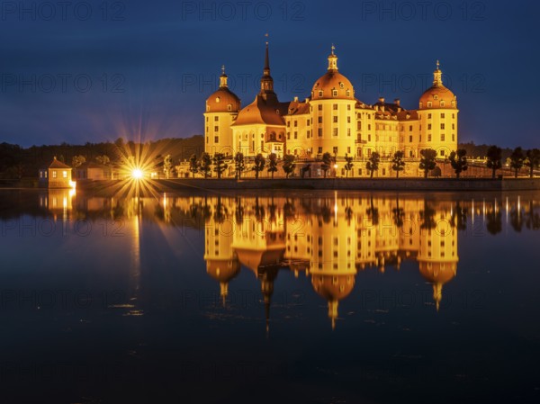 Moritzburg Castle, Augusts the Strong hunting lodge at dusk, water reflection in the lake, Saxony, Germany