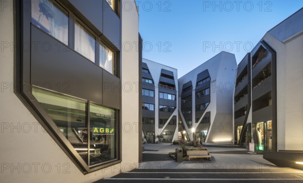 The Sonnenhof at dusk, office and residential building, modern architecture, Jena, Thuringia, Germany