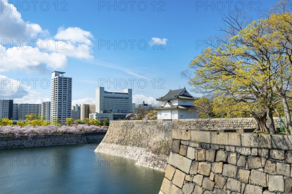 Osaka Castle Wall Watch Tower, Moat Park with Water, Skyscrapers in the Back, Chuo-ku, Osaka, Japan
