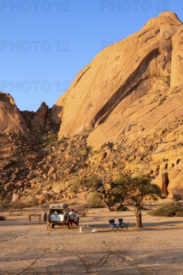 Campground in front of a massive rock face near Spitzkoppe, Spitzkoppe, Namibia