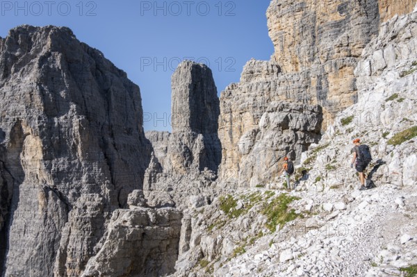 Mountaineers on the Bocchette Centrale band trail, via ferrata in the Brenta Mountains, Brenta-Adamello Natural Park, Trentino, Italy