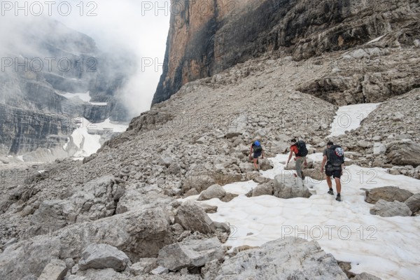 Hikers climbing via Ferrata Detassis, rocky mountain peaks and mountain landscape, Brenta Mountains, Brenta-Adamello Natural Park, Trentino, Italy