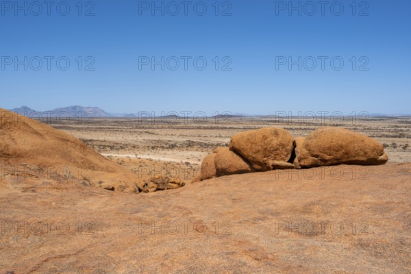 Bushman's paradise, vast, rocky desert under bright blue sky, Spitzkoppe, Namibia