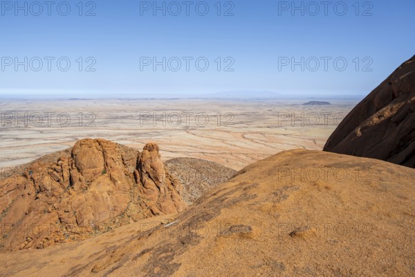 Rock formations with wide desert views under clear skies in Spitzkoppe, Spitzkoppe, Namibia
