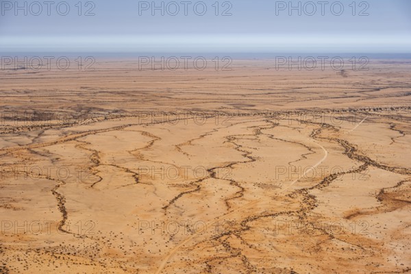 Aerial view of a dry desert with clearly structured landscapes, Spitzkoppe, Namibia