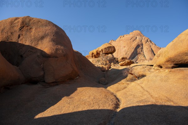 Reddish rocks under bright blue sky in the desert, Spitzkoppe, Namibia