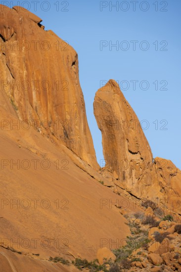 Tall orange rock formations rise majestically, Spitzkoppe, Namibia