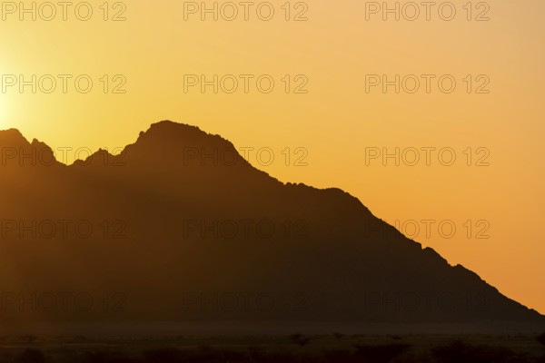 Rugged mountain silhouette at dusk, Spitzkoppe, Namibia