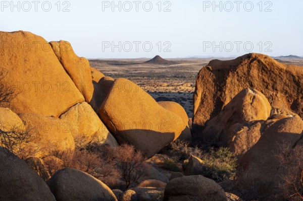 Impressive granite rocks in the barren Spitzkoppe desert with warm evening light, Spitzkoppe, Namibia
