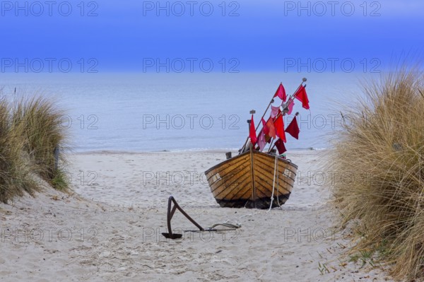 Traditional wooden fishing boat on the beach along the Baltic Sea at Stubbenfelde, Loddin on the island Usedom, Mecklenburg–Western Pomerania, Germany